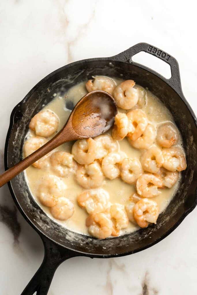 Shrimp Alfredo is creamy, garlicky, and delicious! This quick and easy, under 30-minute recipe is a go-to for busy nights and a year-round family favorite. | aheadofthyme.com