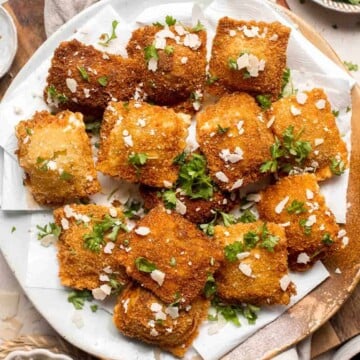 Toasted Ravioli is a classic Italian appetizer that is crispy and golden on the outside, and tender and gooey on the inside. Ready in less than 30 minutes! | aheadofthyme.com