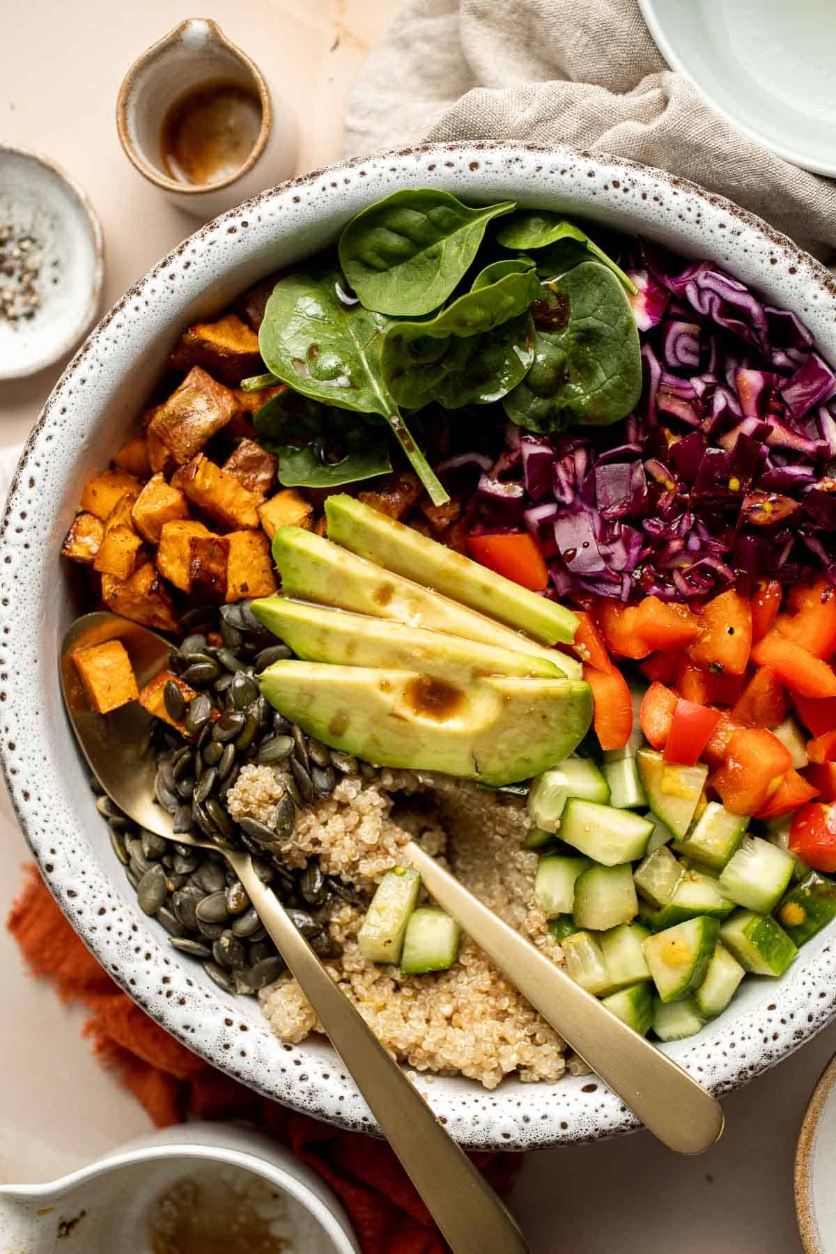 This vegan Buddha Bowl is the perfect hybrid of a salad and grain bowl that is packed with nutritious ingredients like grains, vegetables, and protein. | aheadofthyme.com