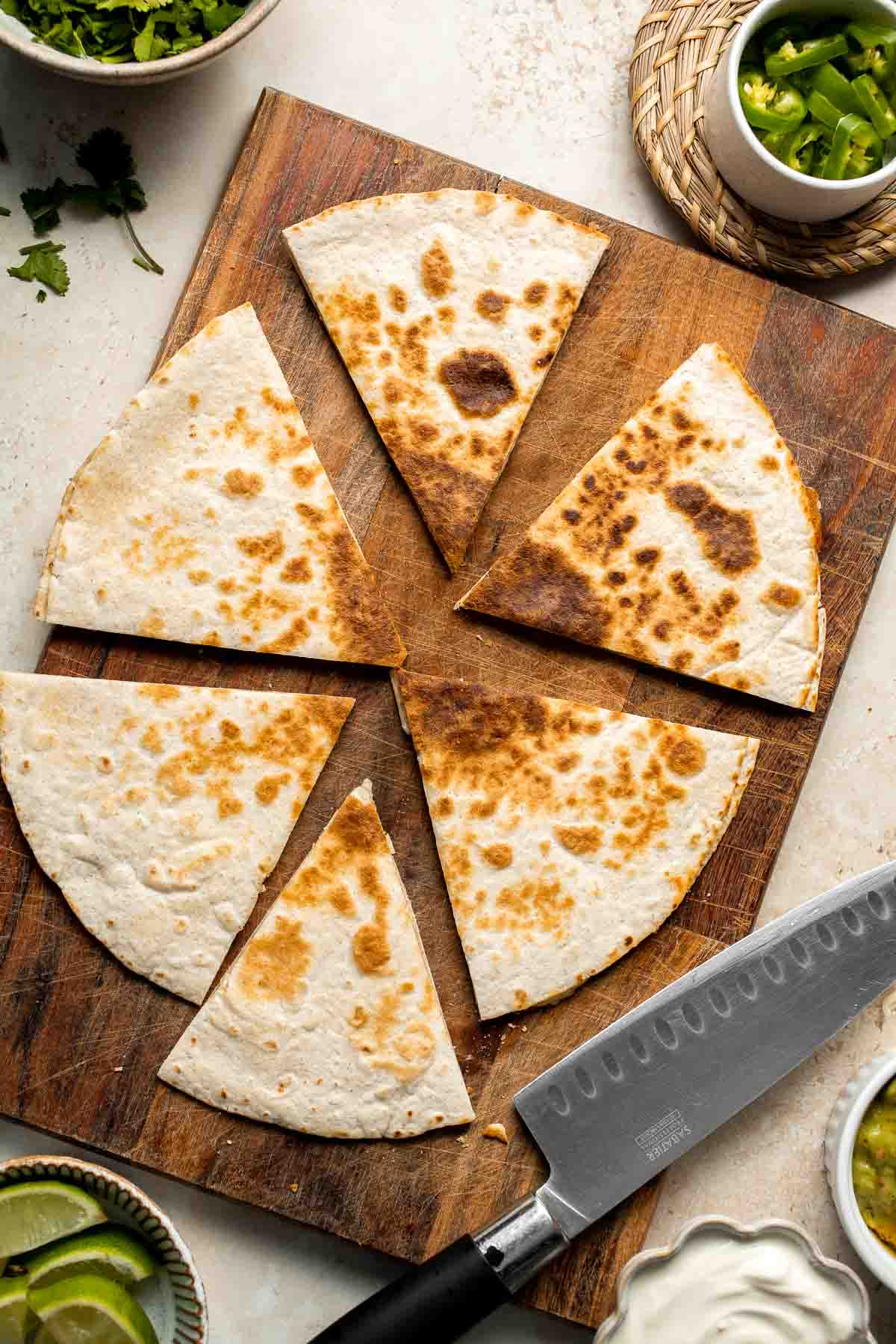 This Cheese Quesadilla has the perfect combination of crispy, cheesy, and flavorful. Ready to serve in just a few minutes with your favorite toppings. | aheadofthyme.com