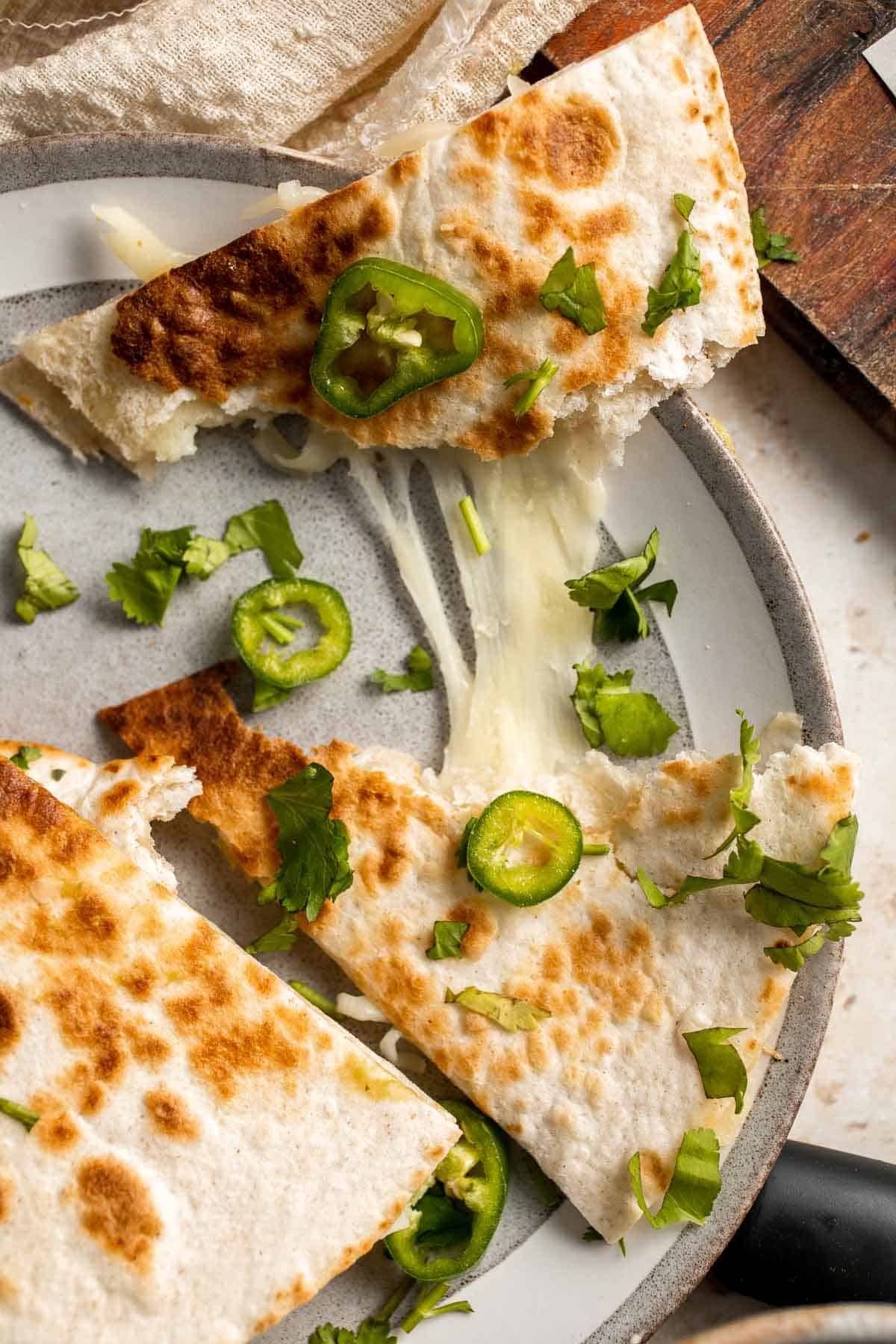 This Cheese Quesadilla has the perfect combination of crispy, cheesy, and flavorful. Ready to serve in just a few minutes with your favorite toppings. | aheadofthyme.com