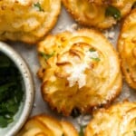 Duchess Potatoes (Pommes Duchesse) are rich, creamy whipped bites of potatoes with crispy edges and a soft fluffy mashed potato centre. A fancy side dish! | aheadofthyme.com