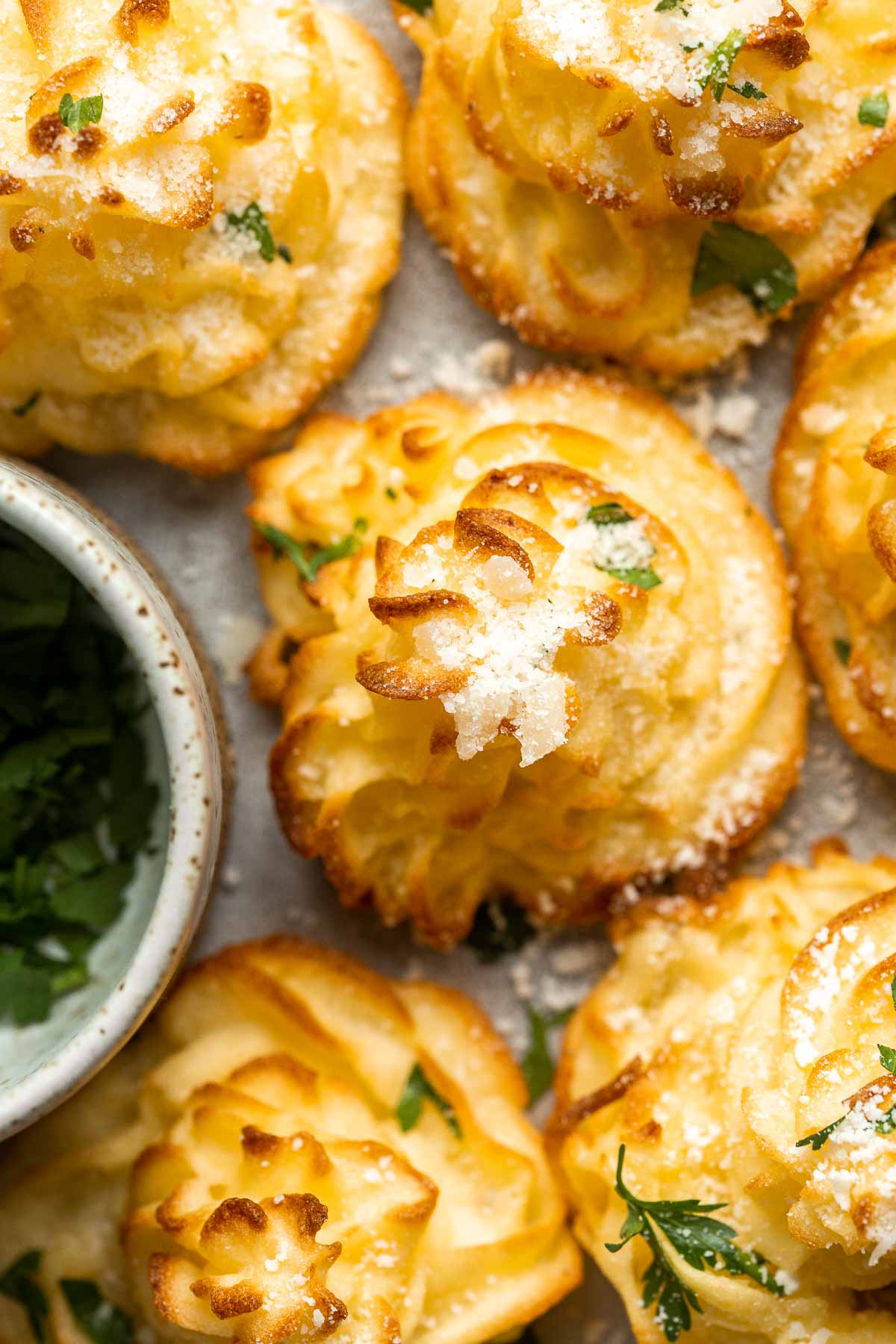 Duchess Potatoes (Pommes Duchesse) are rich, creamy whipped bites of potatoes with crispy edges and a soft fluffy mashed potato centre. A fancy side dish! | aheadofthyme.com