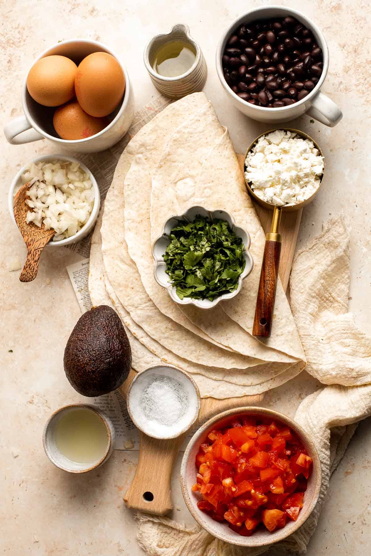 Huevos Rancheros is a classic Mexican breakfast dish that features fried eggs perched atop a bed of warm tortillas and beans and topped with salsa. | aheadofthyme.com