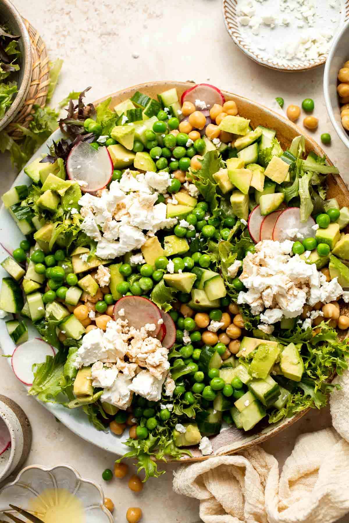 This Spring Salad is light, fresh, and vibrant. It is packed with fresh seasonal vegetables and chickpeas tossed in a homemade honey balsamic dressing. | aheadofthyme.com