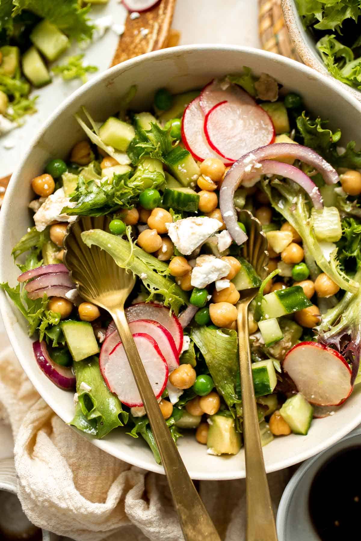 This Spring Salad is light, fresh, and vibrant. It is packed with fresh seasonal vegetables and chickpeas tossed in a homemade honey balsamic dressing. | aheadofthyme.com