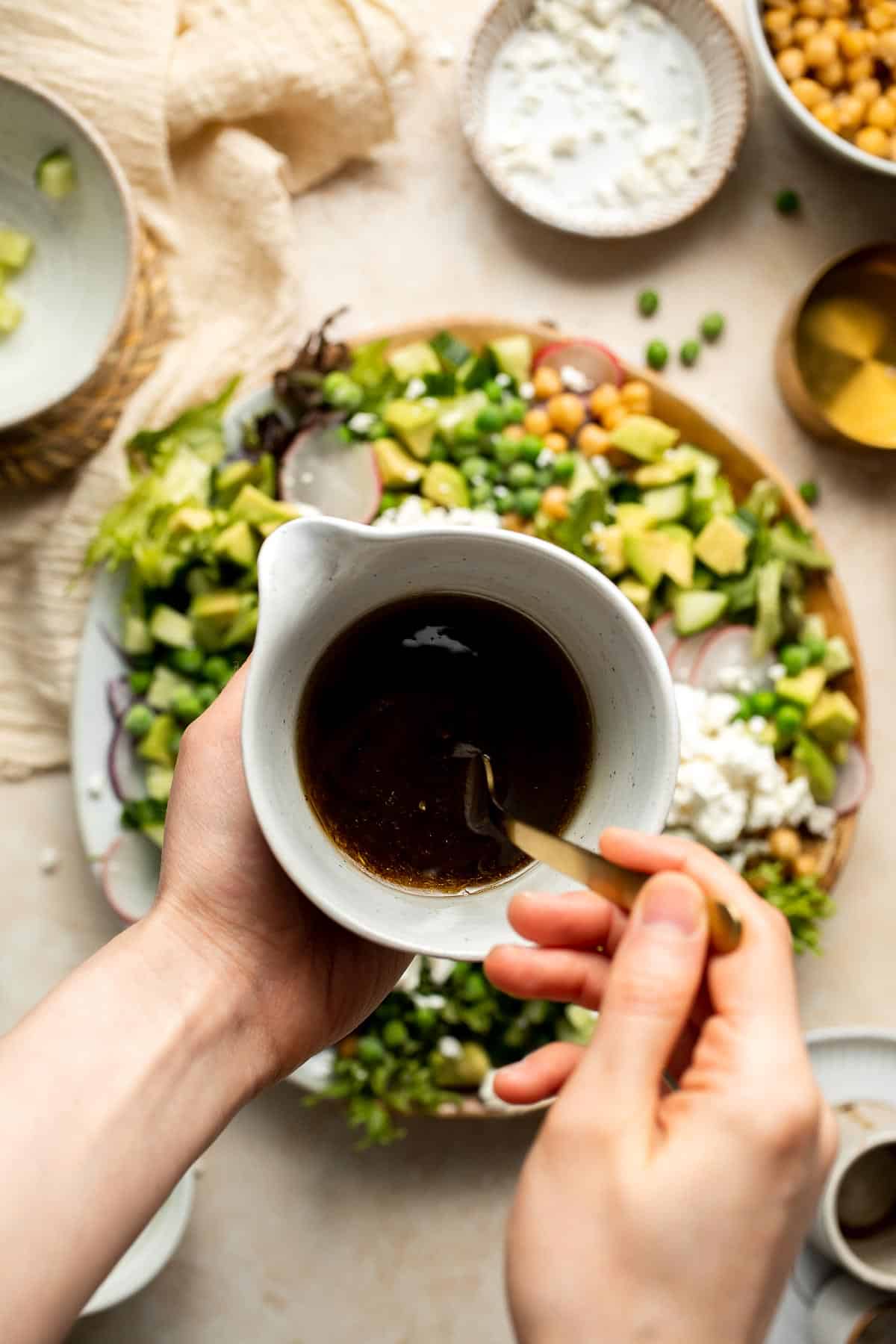 This Spring Salad is light, fresh, and vibrant. It is packed with fresh seasonal vegetables and chickpeas tossed in a homemade honey balsamic dressing. | aheadofthyme.com