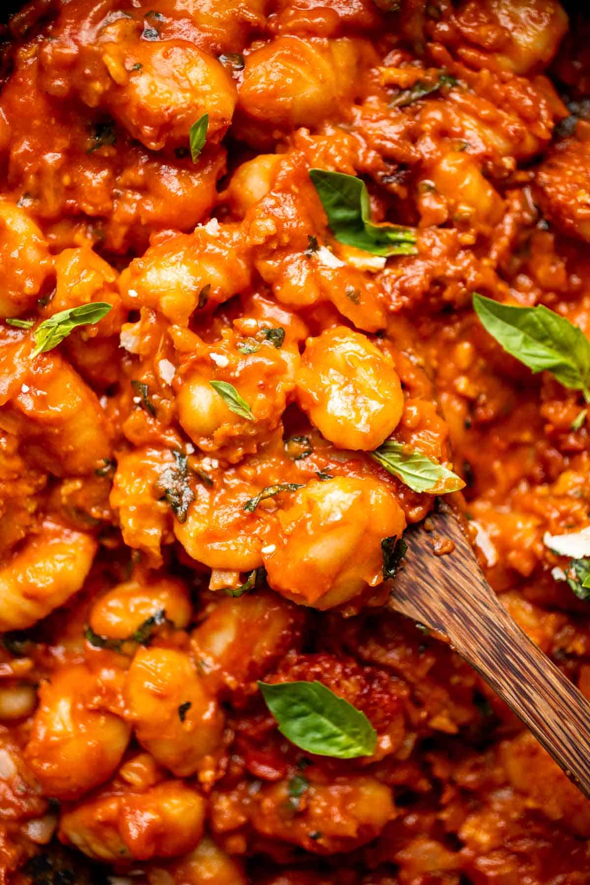 Cheesy Baked Gnocchi is quick and easy comfort food made all in one pot with chewy bites of gnocchi, a simple tomato-based sauce, and gooey melty cheese. | aheadofthyme.com