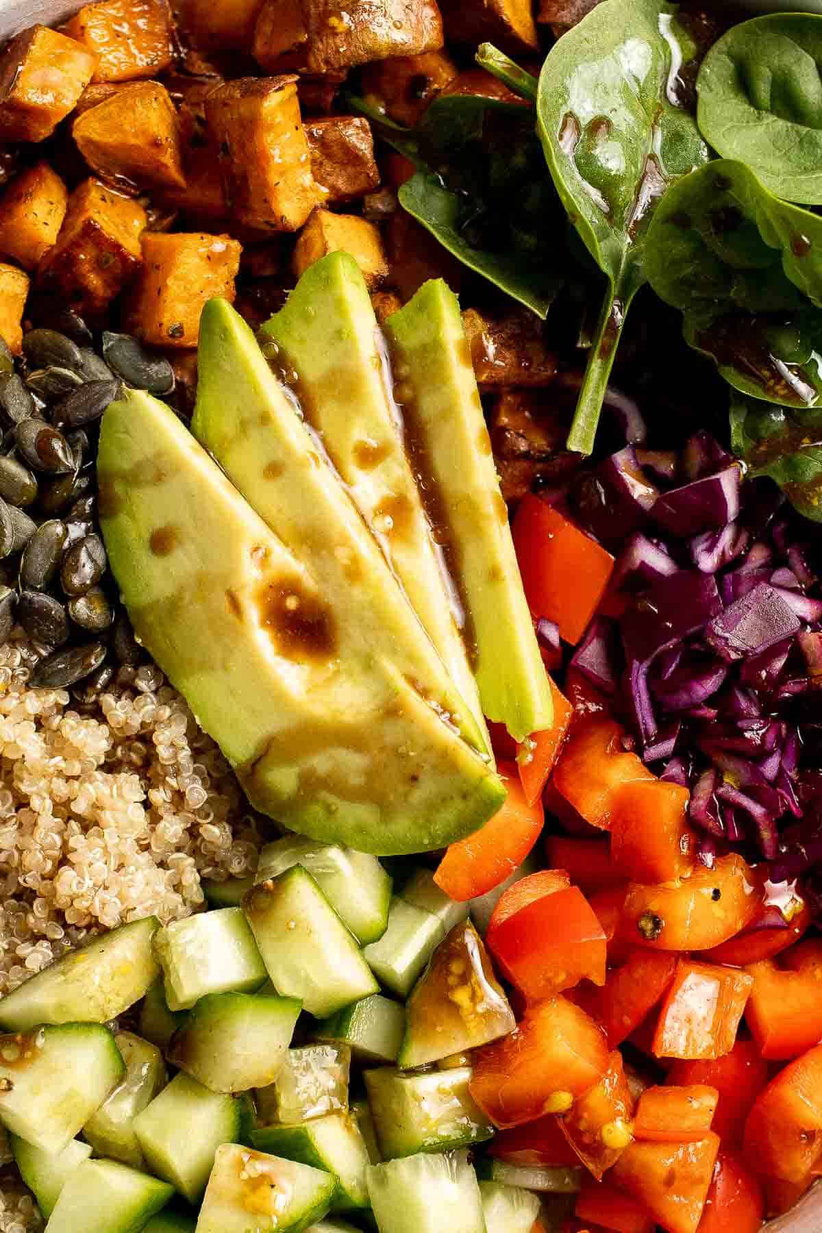 This vegan Buddha Bowl is the perfect hybrid of a salad and grain bowl that is packed with nutritious ingredients like grains, vegetables, and protein. | aheadofthyme.com