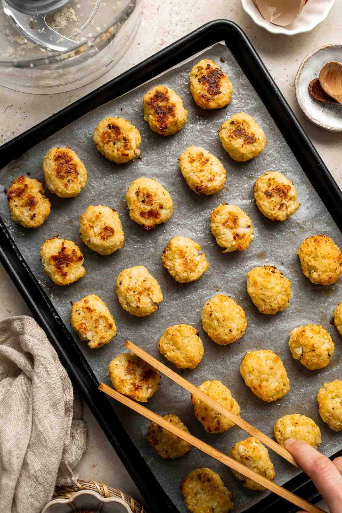 These Cauliflower Tots are everything you want in a tater tot — but better! They are crunchy on the outside, tender inside, higher in fiber, and cheesy. | aheadofthyme.com