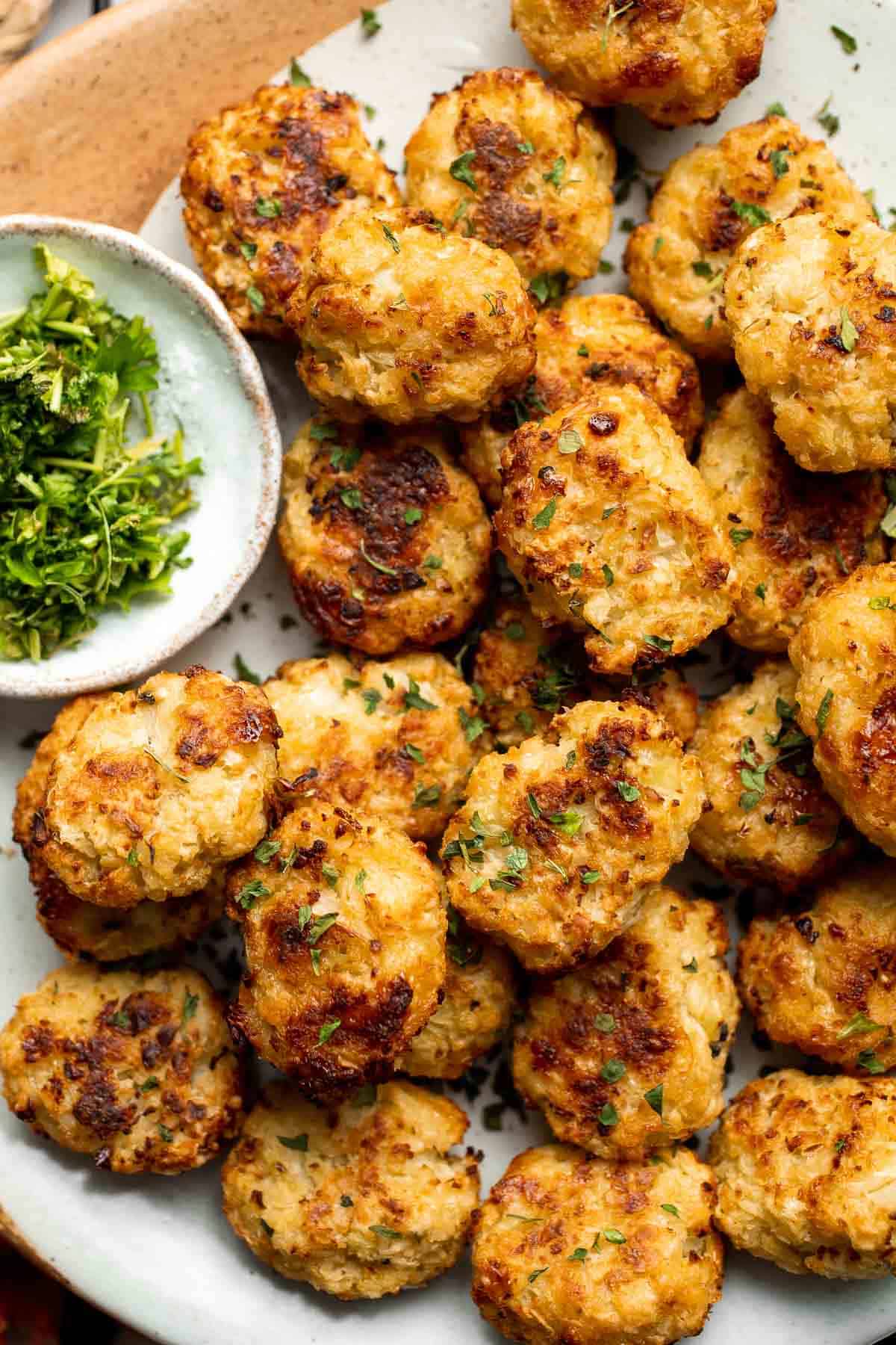 These Cauliflower Tots are everything you want in a tater tot — but better! They are crunchy on the outside, tender inside, higher in fiber, and cheesy. | aheadofthyme.com