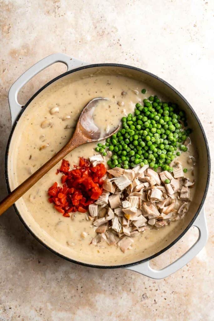 Chicken a la King is rich, creamy, and hearty comfort food. This 30-minute dinner recipe contains chicken and veggies in a cream sauce made from scratch. | aheadofthyme.com