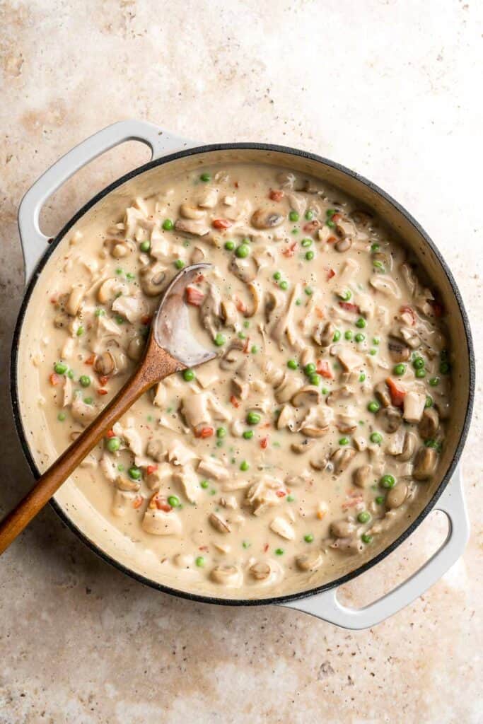 Chicken a la King is rich, creamy, and hearty comfort food. This 30-minute dinner recipe contains chicken and veggies in a cream sauce made from scratch. | aheadofthyme.com