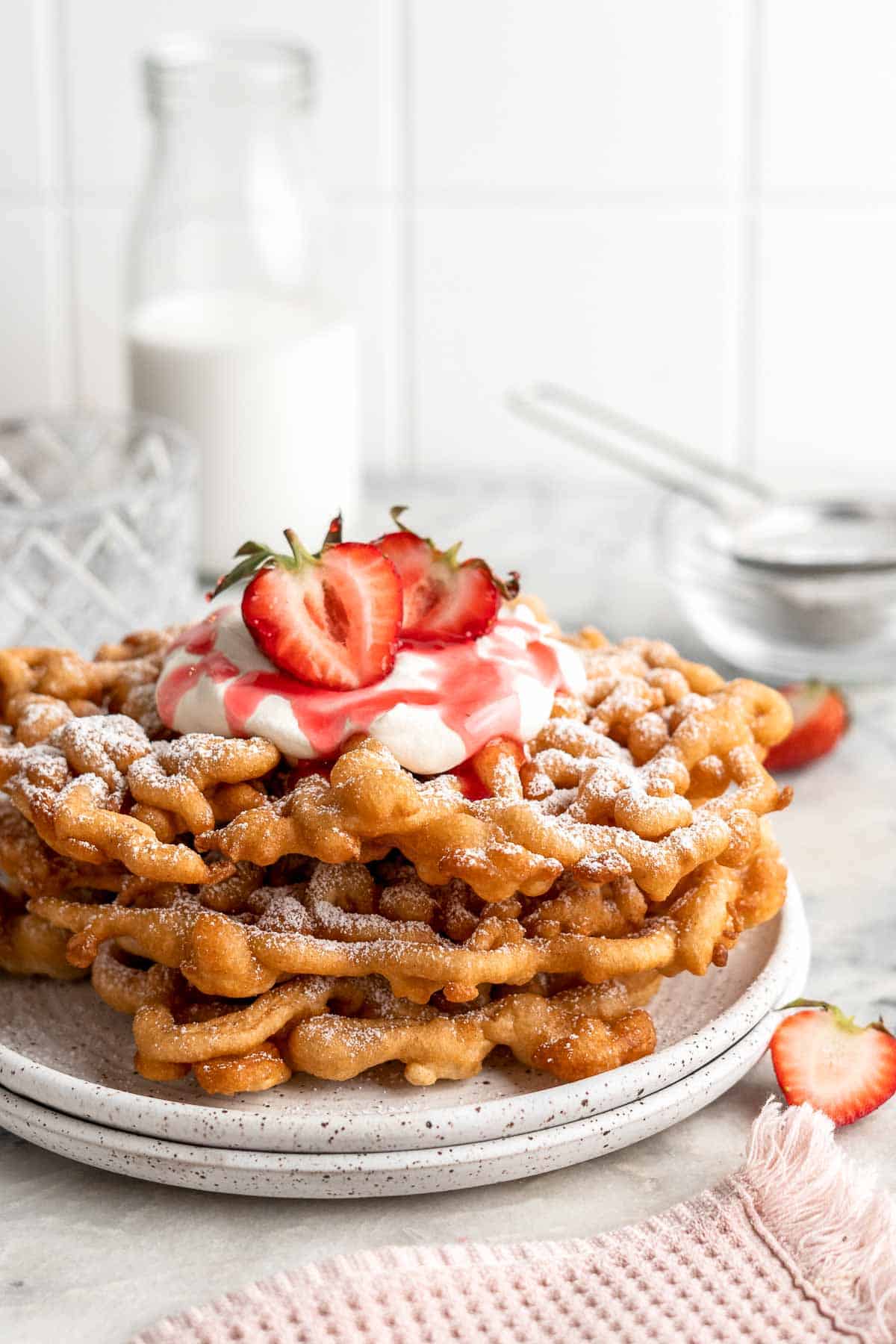 There’s truly nothing like a homemade Funnel Cake: a crispy jumble of crispy vanilla-tinged batter fried and topped with a powdered sugar, and served warm. | aheadofthyme.com