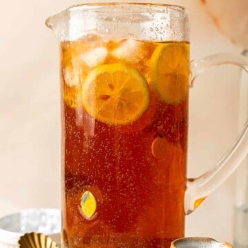 This Homemade Iced Tea made with only 10 minutes of prep using green or black tea, sugar, and water is sweet and refreshing — a perfect summer drink. | aheadofthyme.com