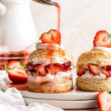 Classic Strawberry Shortcake is a small, layered cake featuring fluffy crumbly biscuits, a fresh strawberry filling, and homemade whipped cream. | aheadofthyme.com