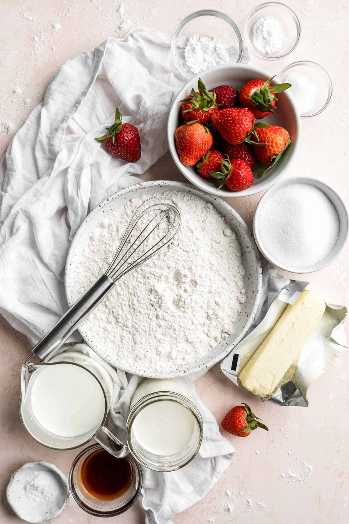 Classic Strawberry Shortcake is a small, layered cake featuring fluffy crumbly biscuits, a fresh strawberry filling, and homemade whipped cream. | aheadofthyme.com