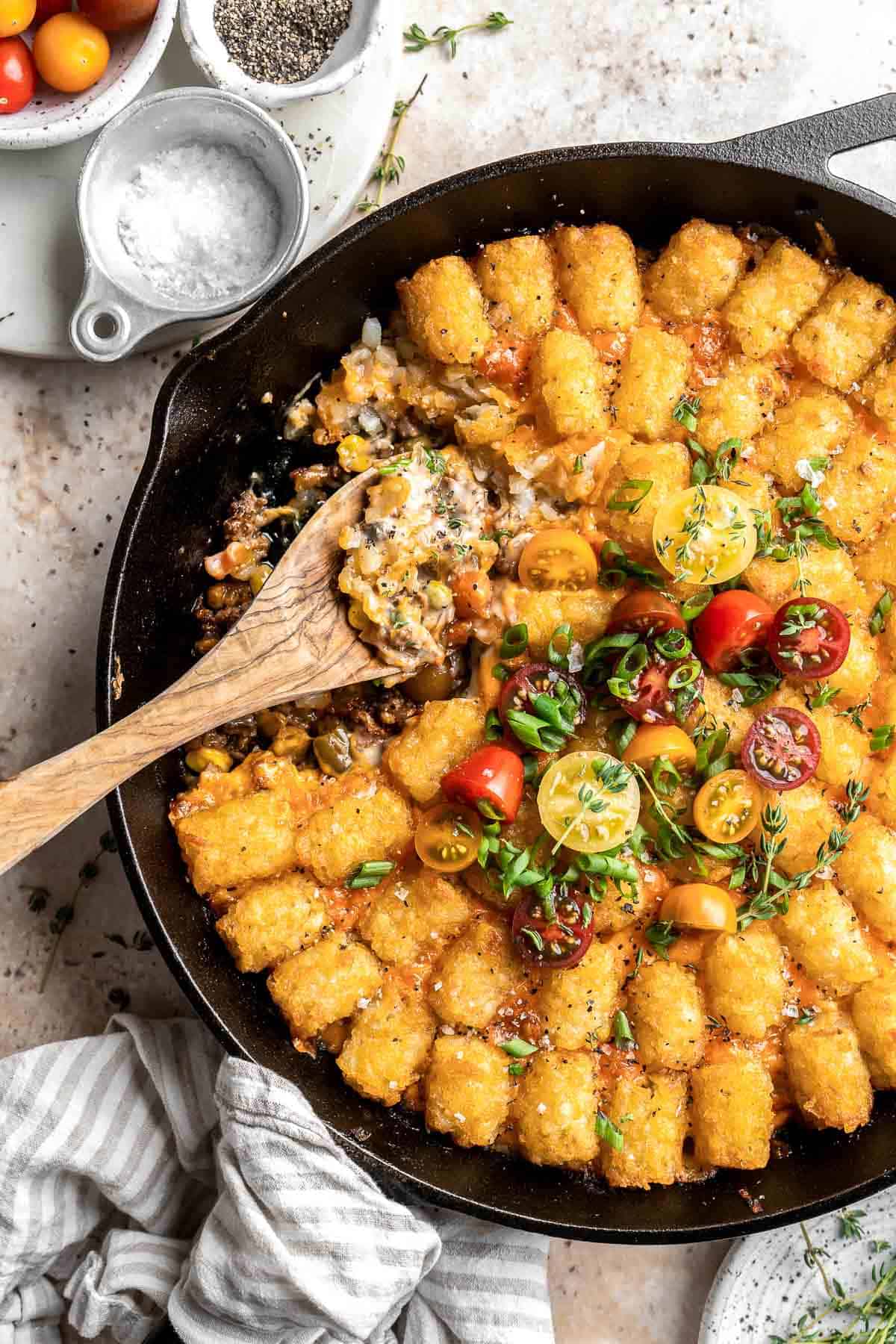 Tater Tot Casserole is classic comfort food that incorporates delicious layers of crispy tater tots, melted cheese and a creamy beef and vegetables mixture. | aheadofthyme.com