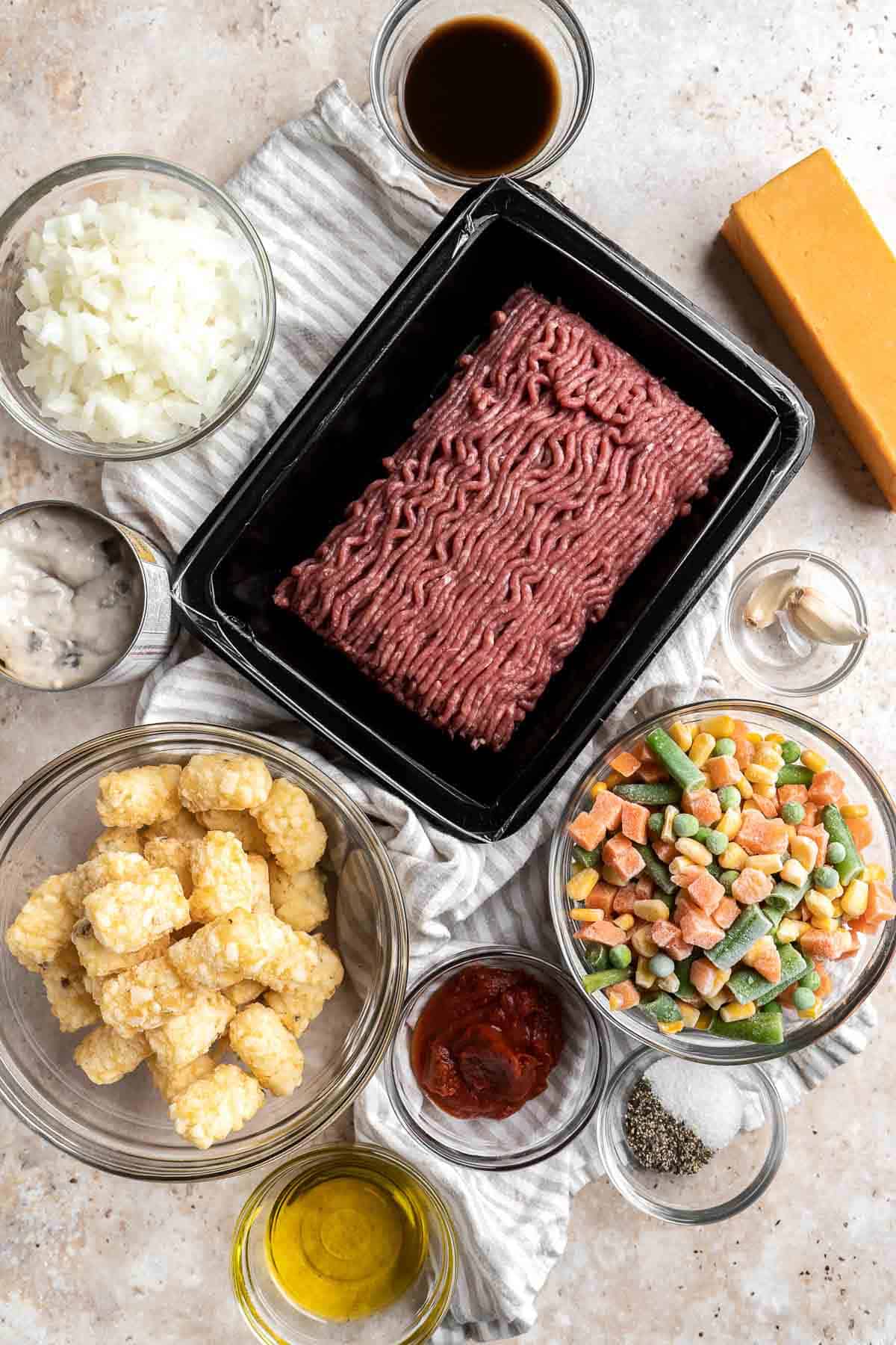 Tater Tot Casserole is classic comfort food that incorporates delicious layers of crispy tater tots, melted cheese and a creamy beef and vegetables mixture. | aheadofthyme.com