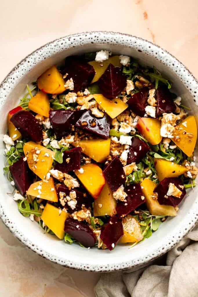 Beet Salad is a light, fresh, and vibrant salad packed with nutrients. It is loaded with beets, greens, feta, and walnuts, tossed in a homemade vinaigrette. | aheadofthyme.com