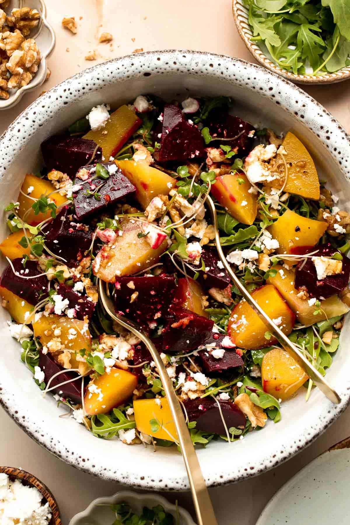 Beet Salad is a light, fresh, and vibrant salad packed with nutrients. It is loaded with beets, greens, feta, and walnuts, tossed in a homemade vinaigrette. | aheadofthyme.com