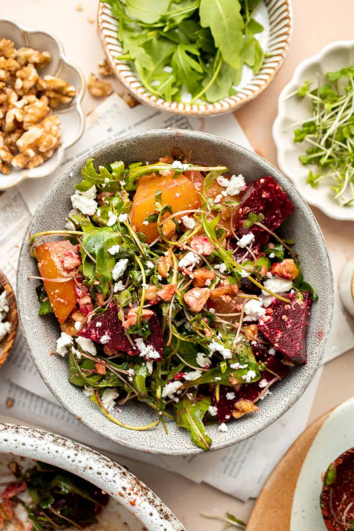 Beet Salad is a light, fresh, and vibrant salad packed with nutrients. It is loaded with beets, greens, feta, and walnuts, tossed in a homemade vinaigrette. | aheadofthyme.com