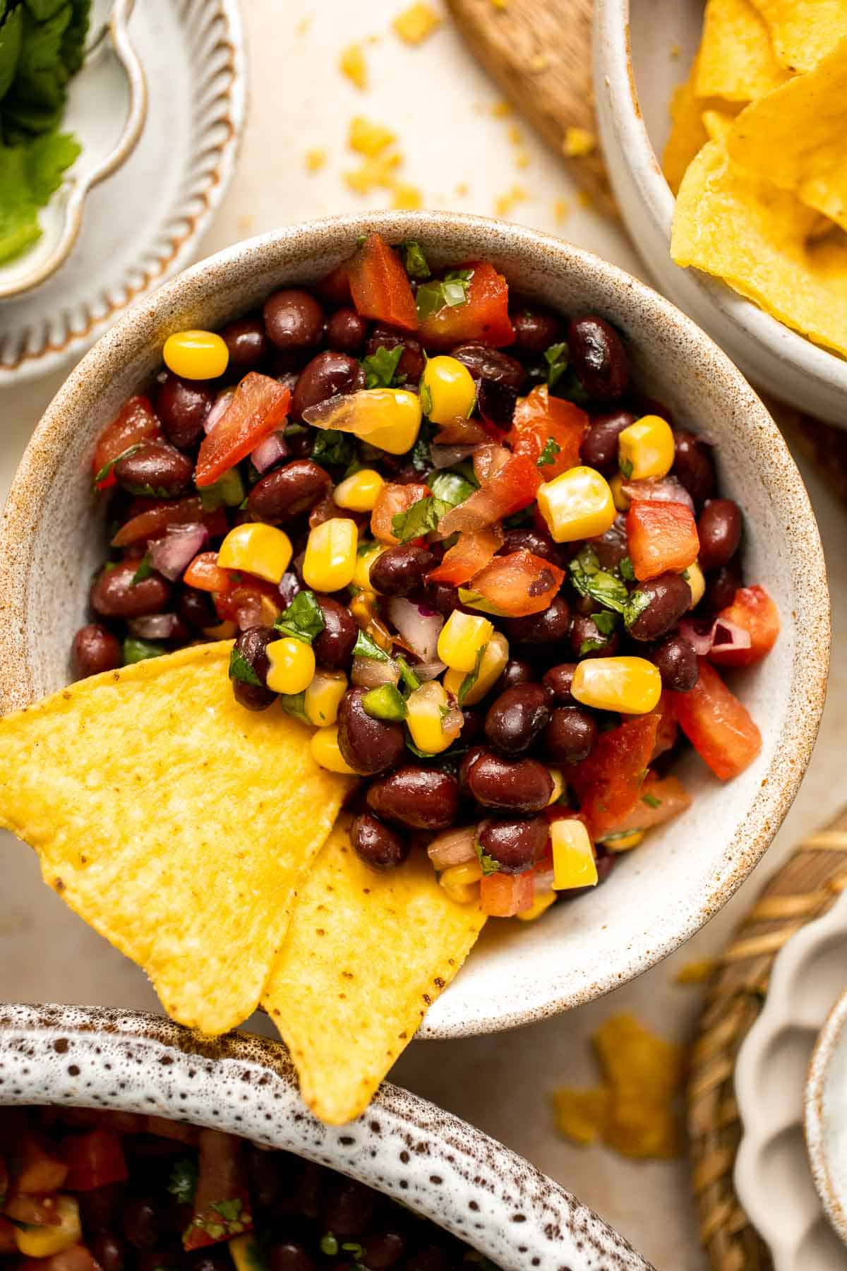 This quick and easy Black Bean Salsa is a delicious Mexican dip loaded with black beans, veggies, cilantro, and lime juice for the best summer flavor. | aheadofthyme.com