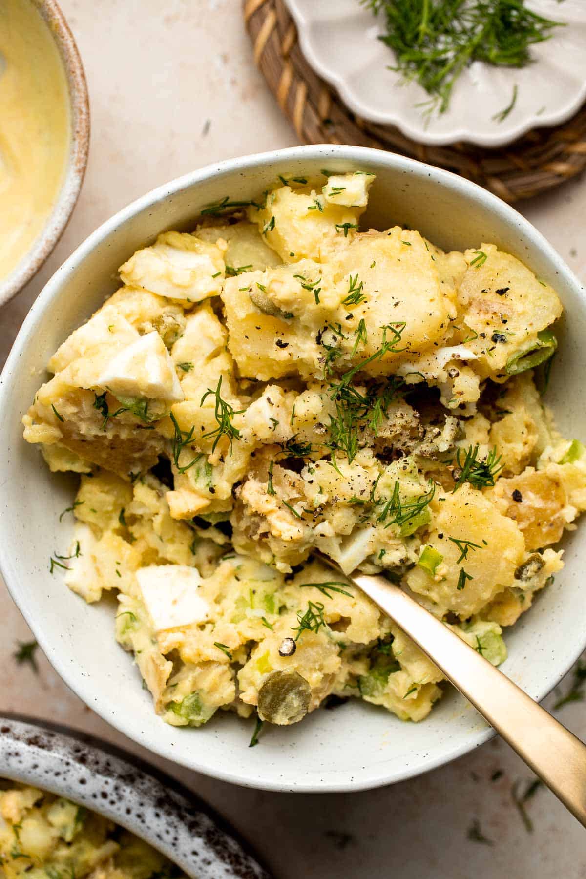 Classic Potato Salad is tangy and creamy with chunks of fluffy potatoes, soft eggs, and crunchy vegetables. It’s a perfect, quick and easy summer side dish. | aheadofthyme.com