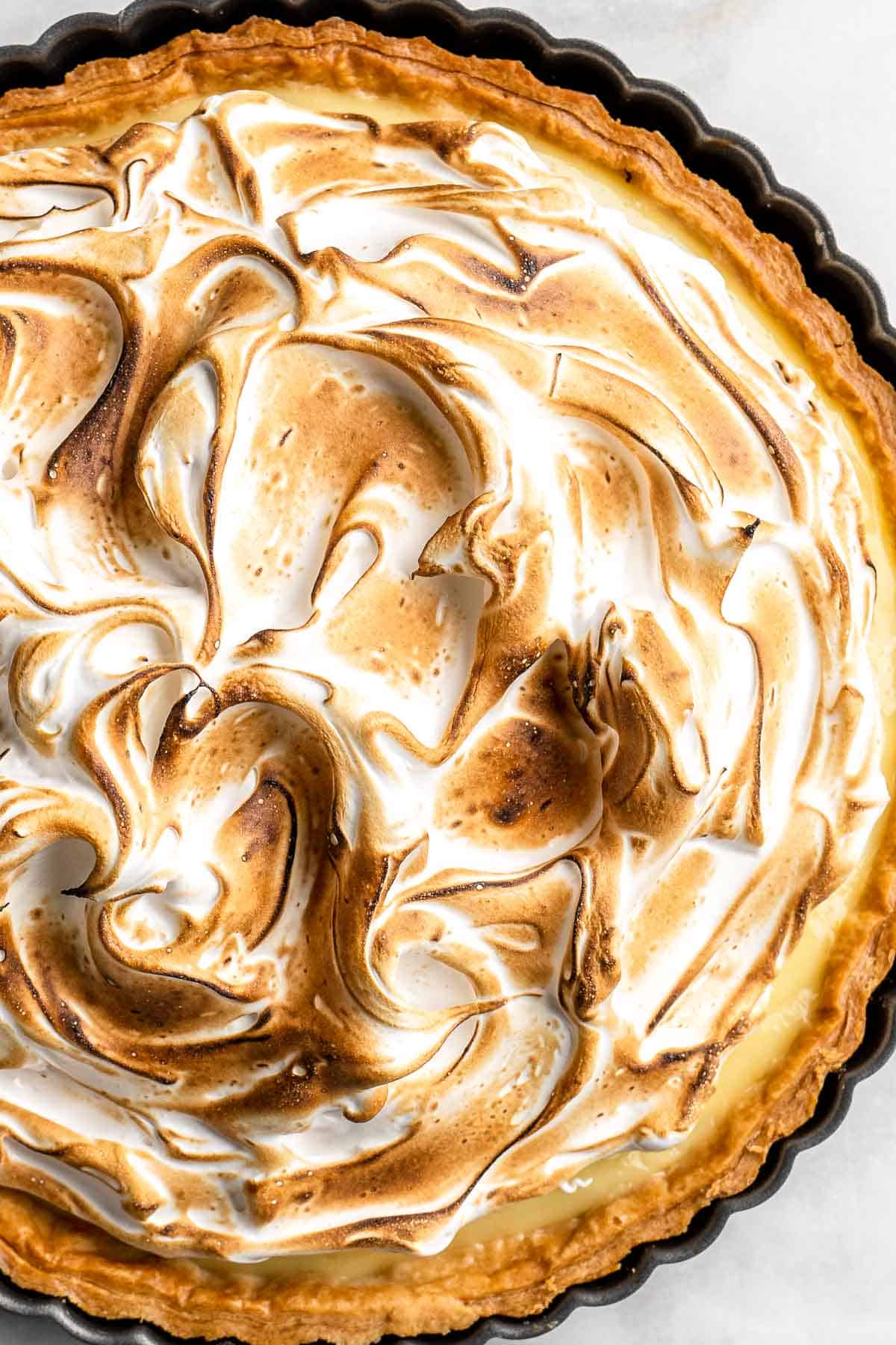 Lemon Meringue Pie made with delicate peaks of golden-brown meringue, creamy and tart lemon curd filling, and flaky pie crust is the best homemade pie ever! | aheadofthyme.com