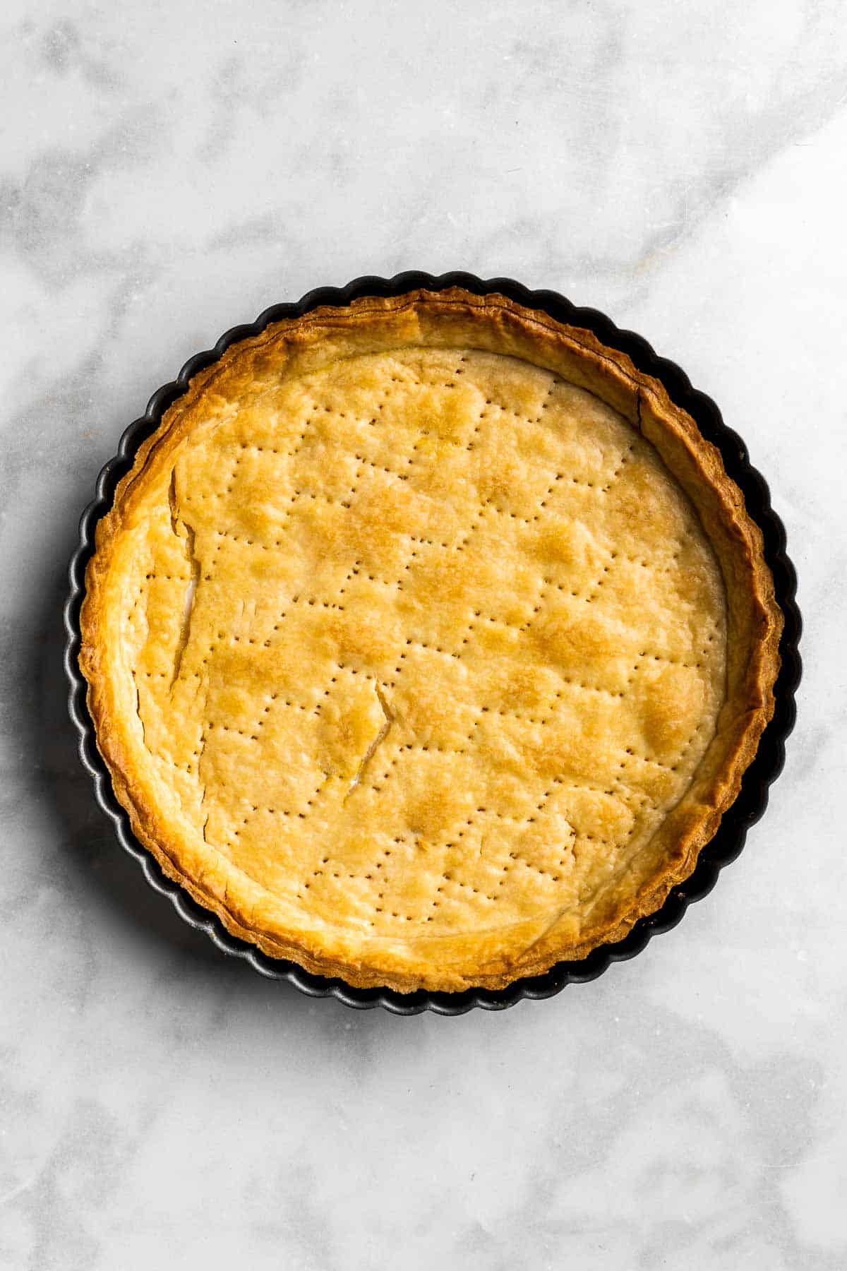 Lemon Meringue Pie made with delicate peaks of golden-brown meringue, creamy and tart lemon curd filling, and flaky pie crust is the best homemade pie ever! | aheadofthyme.com