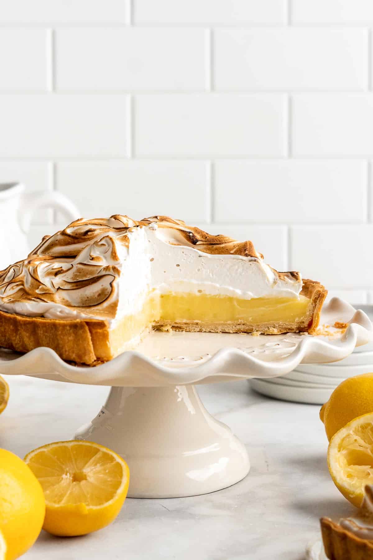 Lemon Meringue Pie made with delicate peaks of golden-brown meringue, creamy and tart lemon curd filling, and flaky pie crust is the best homemade pie ever! | aheadofthyme.com