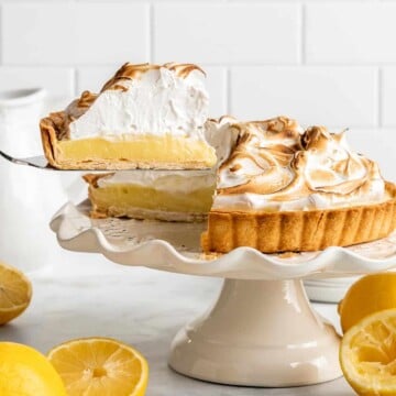 Lemon Meringue Pie made with delicate peaks of golden-brown meringue, creamy and tart lemon curd filling, and flaky pie crust is the best homemade pie ever! | aheadofthyme.com