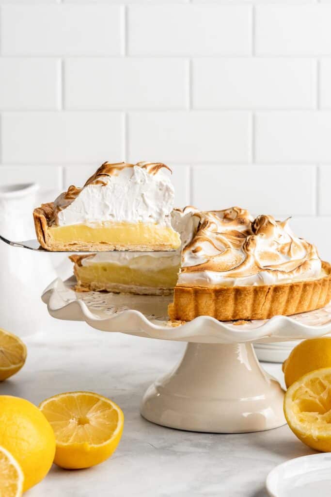 Lemon Meringue Pie made with delicate peaks of golden-brown meringue, creamy and tart lemon curd filling, and flaky pie crust is the best homemade pie ever! | aheadofthyme.com