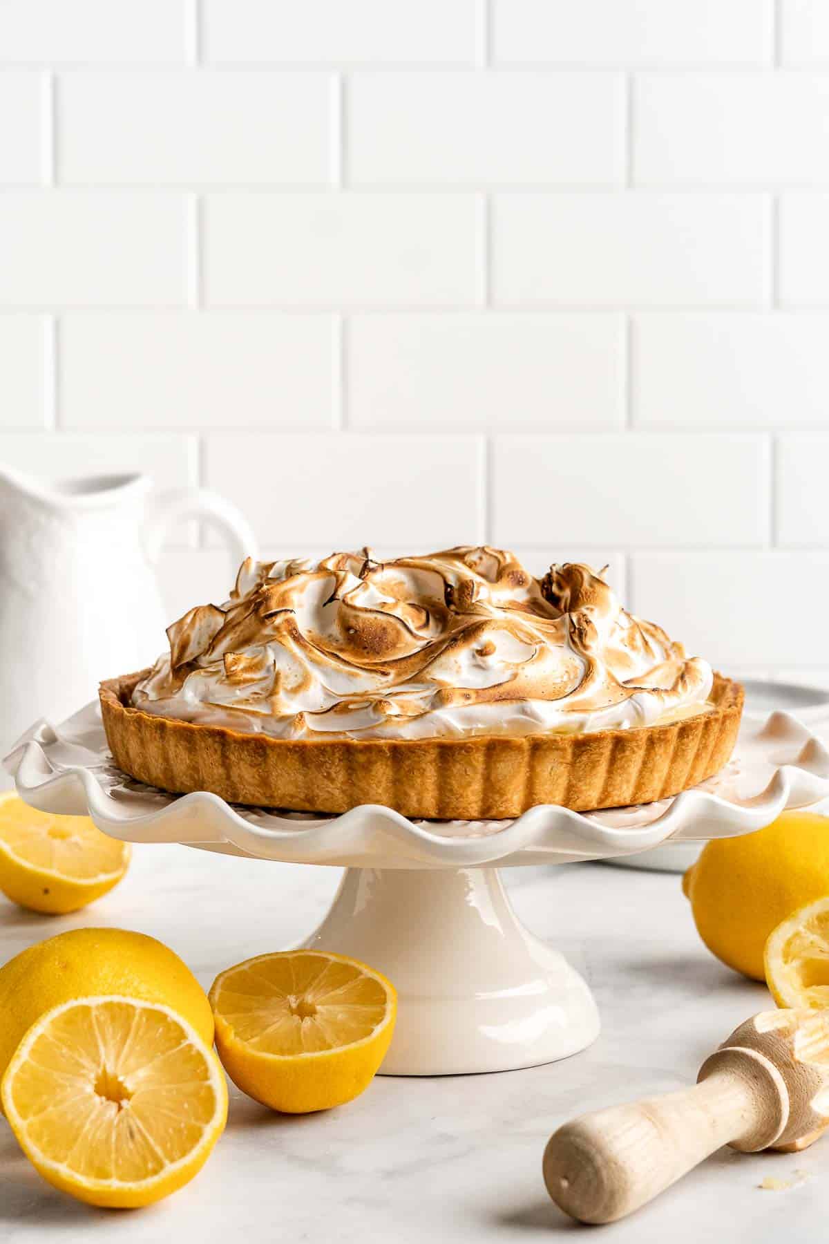 Lemon Meringue Pie made with delicate peaks of golden-brown meringue, creamy and tart lemon curd filling, and flaky pie crust is the best homemade pie ever! | aheadofthyme.com