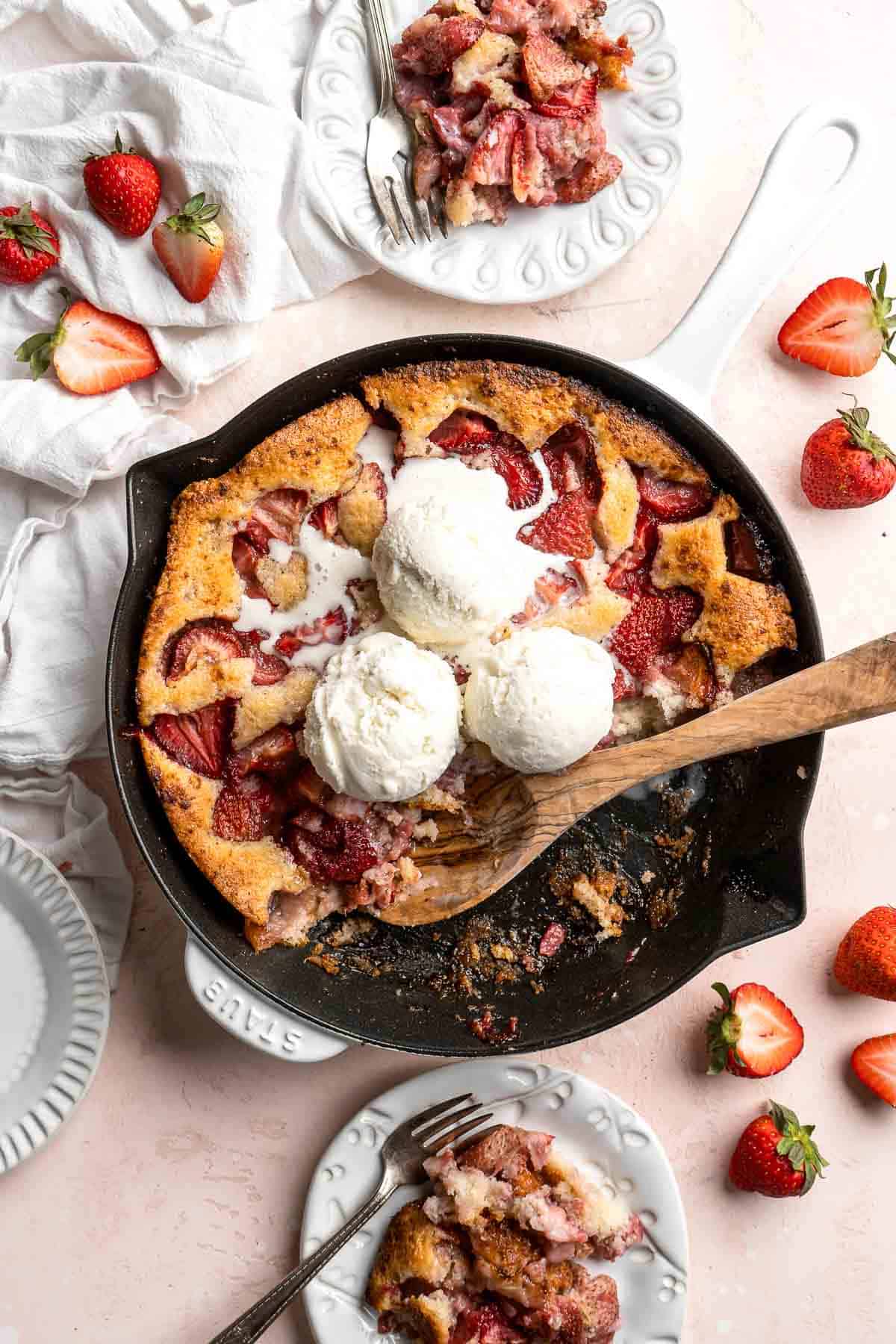 Strawberry Cobbler made with sweet, gooey strawberries and light, fluffy cakey batter is an easy summer dessert to make from scratch with 10 minutes prep. | aheadofthyme.com