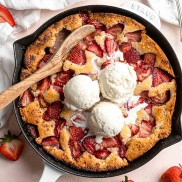 Strawberry Cobbler made with sweet, gooey strawberries and light, fluffy cakey batter is an easy summer dessert to make from scratch with 10 minutes prep. | aheadofthyme.com