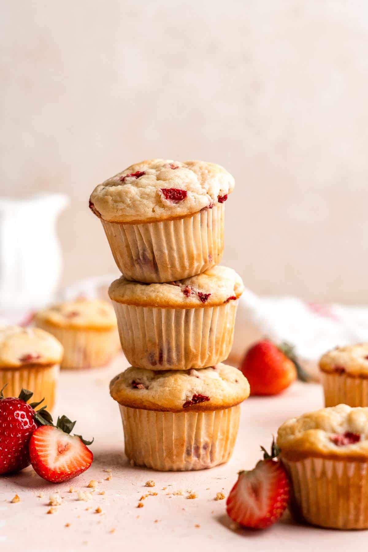 Strawberry Muffins are tender, fluffy, and delicious! They are golden-brown and crisp outside while moist and cake-like inside and loaded with strawberries. | aheadofthyme.com