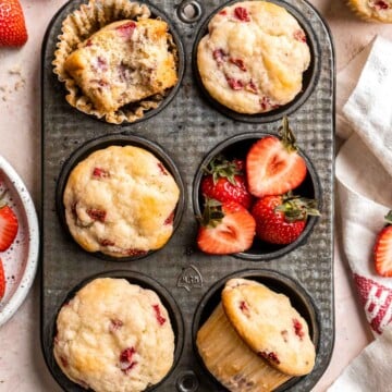 Strawberry Muffins are tender, fluffy, and delicious! They are golden-brown and crisp outside while moist and cake-like inside and loaded with strawberries. | aheadofthyme.com