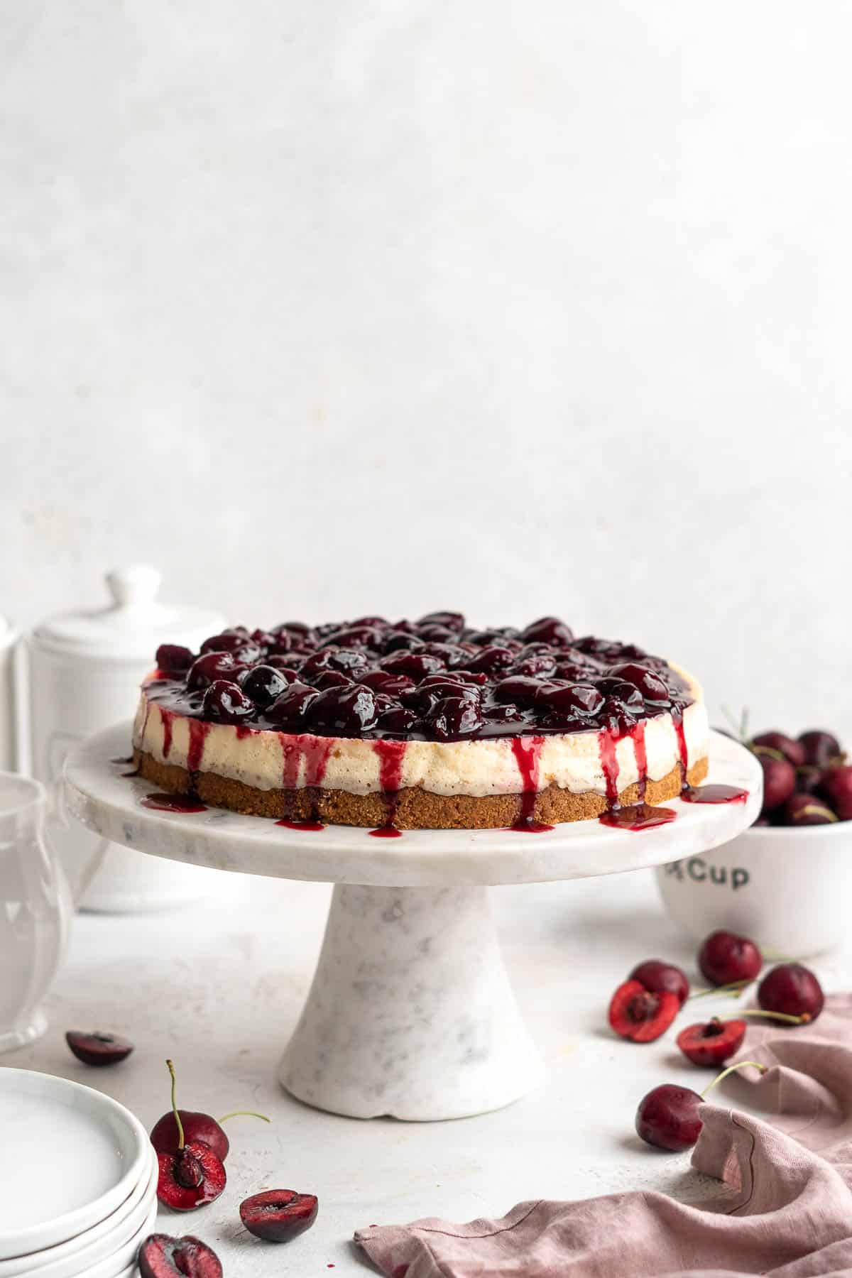 Cherry Cheesecake is lush, velvety, and creamy finished with a heap of sweet homemade cherry sauce on top. The perfect summer dessert with cherries! | aheadofthyme.com