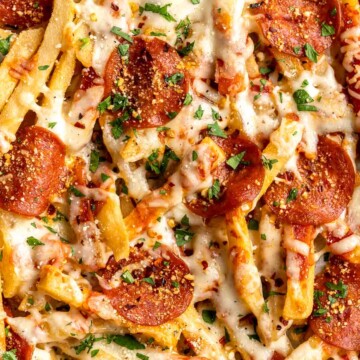 Baked Pizza Fries are loaded with a rich marinara sauce, melted cheese, and crispy pepperoni — transforming ordinary fries into the ultimate finger food. | aheadofthyme.com