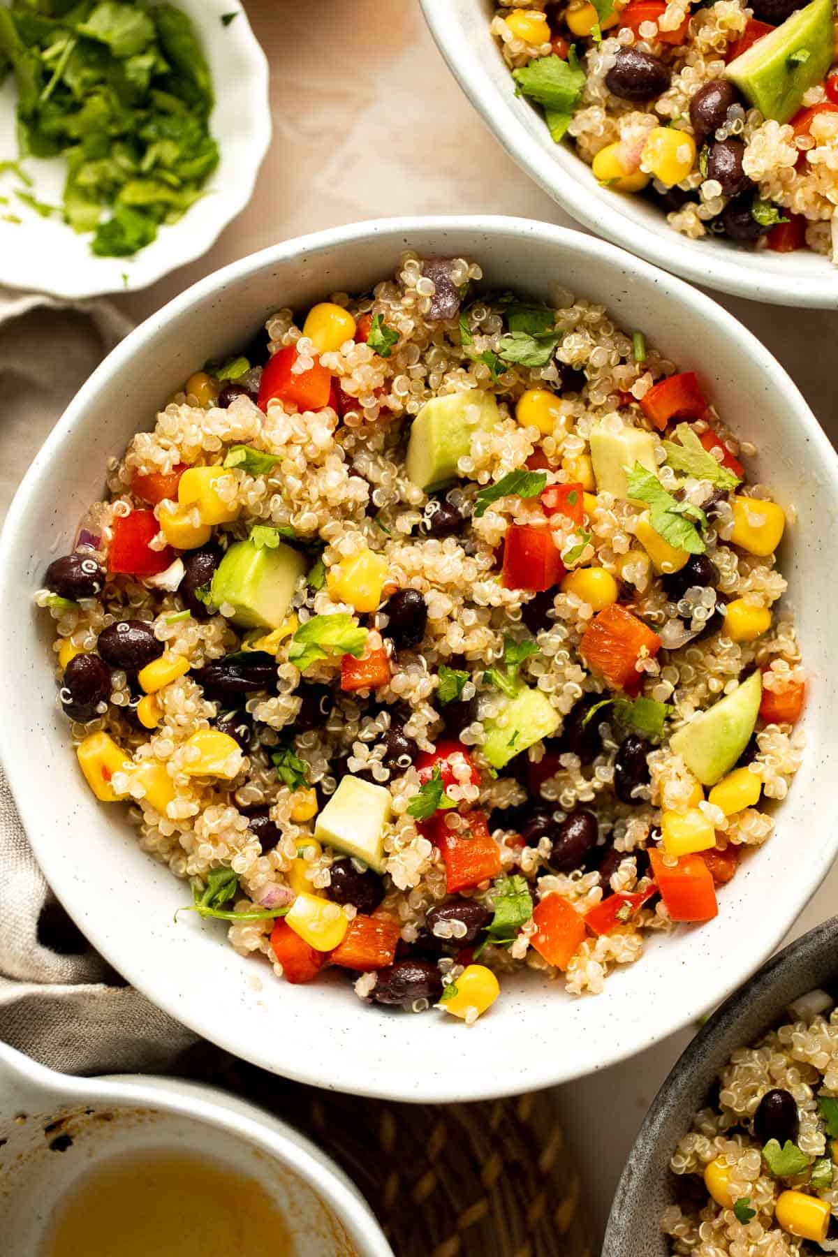 Southwest Quinoa Salad is hearty, flavorful, and delicious. It's loaded with chunky vegetables and tender quinoa, coated in a tangy homemade dressing. | aheadofthyme.com
