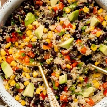 Southwest Quinoa Salad is hearty, flavorful, and delicious. It's loaded with chunky vegetables and tender quinoa, coated in a tangy homemade dressing. | aheadofthyme.com