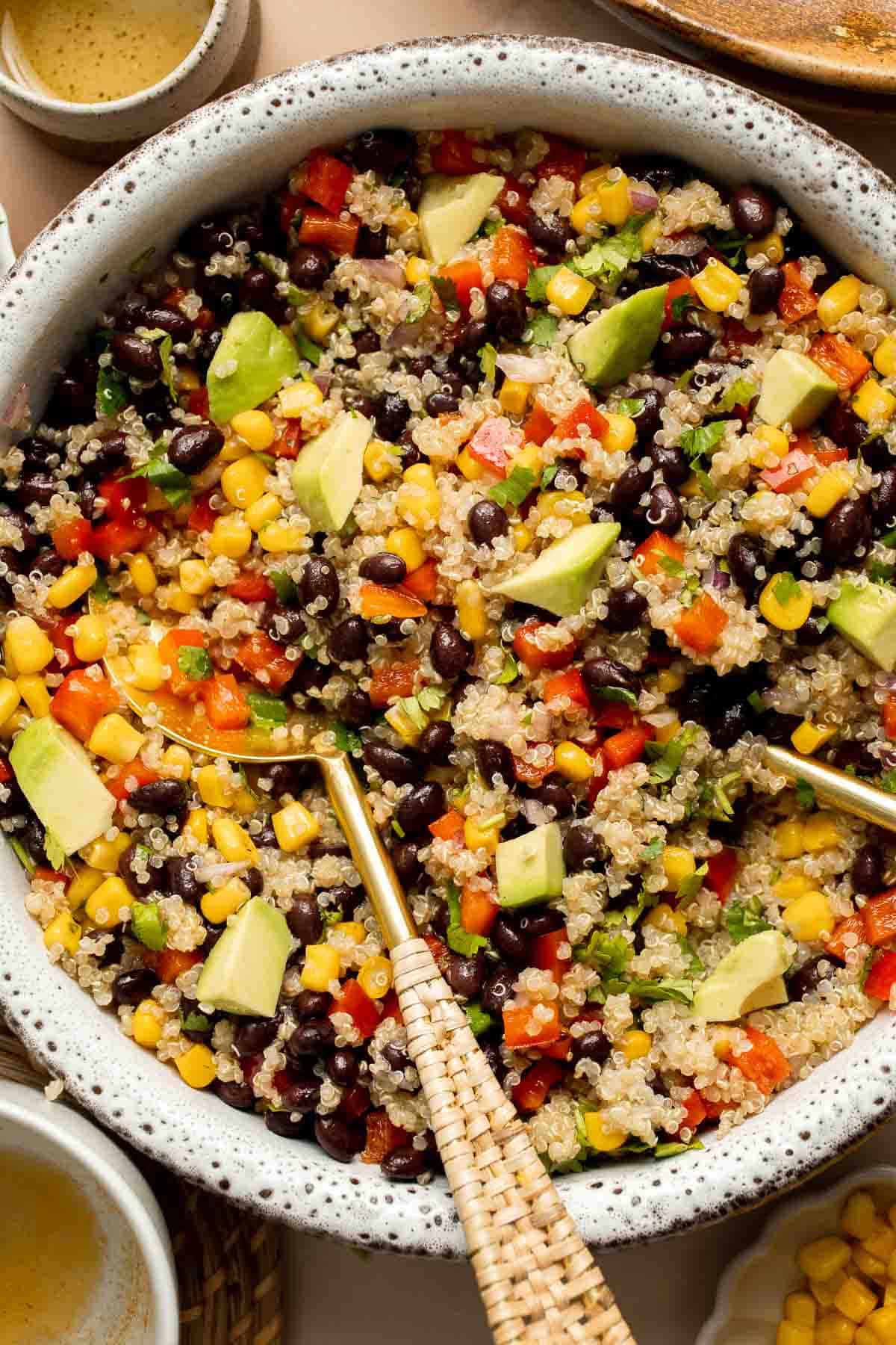 Southwest Quinoa Salad is hearty, flavorful, and delicious. It's loaded with chunky vegetables and tender quinoa, coated in a tangy homemade dressing. | aheadofthyme.com