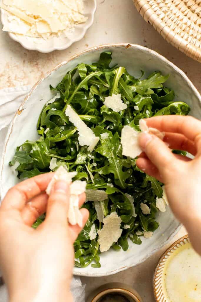 Arugula Salad with Parmesan cheese and a simple homemade lemon dressing is healthy, fresh, and delicious. Toss it together in just 5 minutes! | aheadofthyme.com