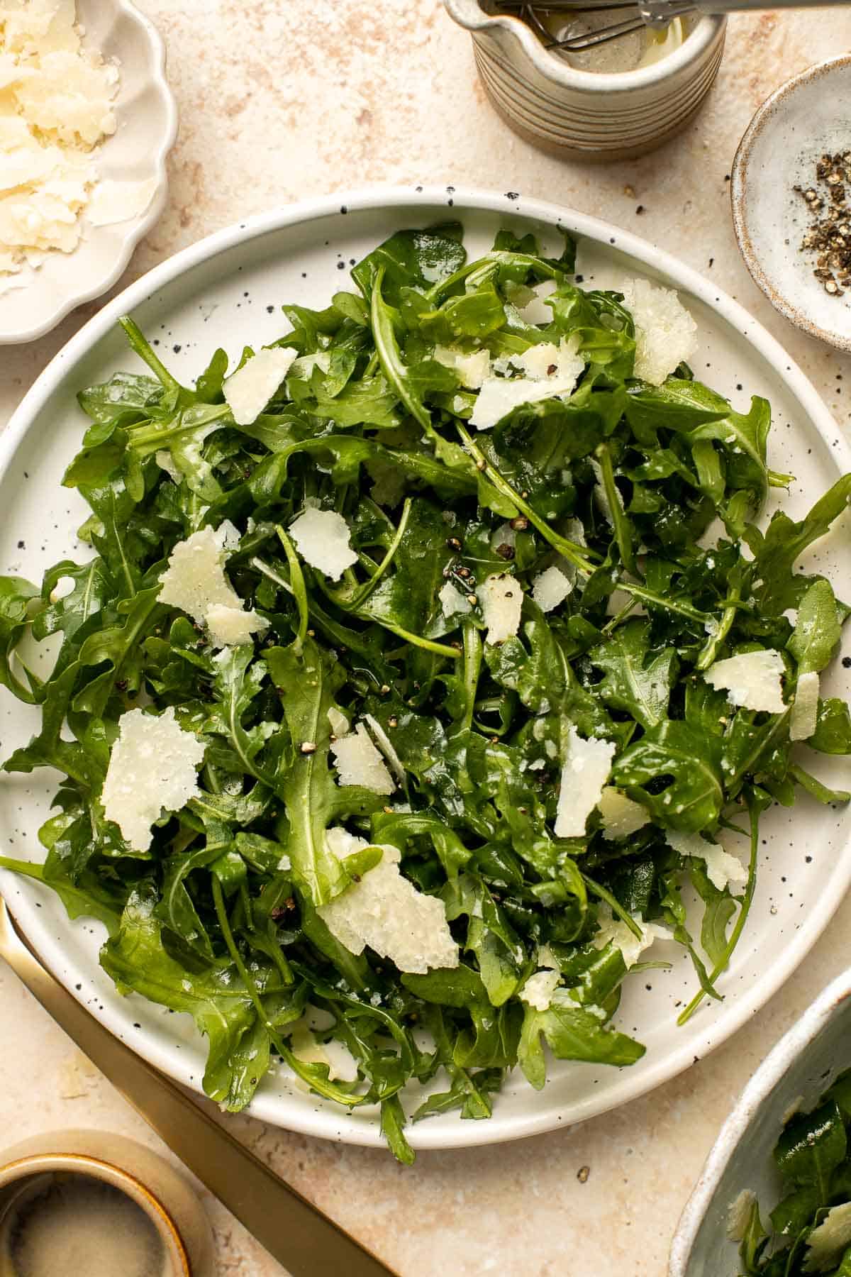 Arugula Salad with Parmesan cheese and a simple homemade lemon dressing is healthy, fresh, and delicious. Toss it together in just 5 minutes! | aheadofthyme.com