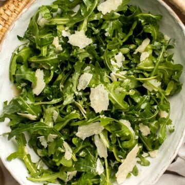 Arugula Salad with Parmesan cheese and a simple homemade lemon dressing is healthy, fresh, and delicious. Toss it together in just 5 minutes! | aheadofthyme.com