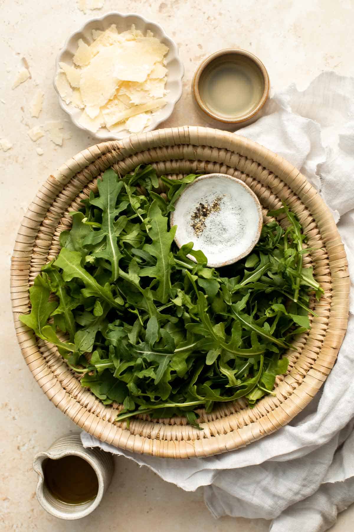 Arugula Salad with Parmesan cheese and a simple homemade lemon dressing is healthy, fresh, and delicious. Toss it together in just 5 minutes! | aheadofthyme.com