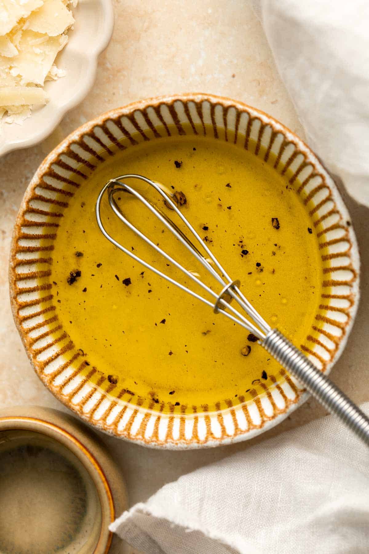 Arugula Salad with Parmesan cheese and a simple homemade lemon dressing is healthy, fresh, and delicious. Toss it together in just 5 minutes! | aheadofthyme.com