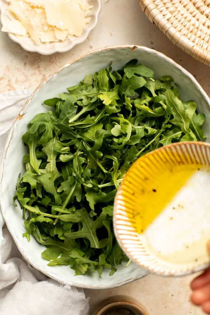 Arugula Salad with Parmesan cheese and a simple homemade lemon dressing is healthy, fresh, and delicious. Toss it together in just 5 minutes! | aheadofthyme.com