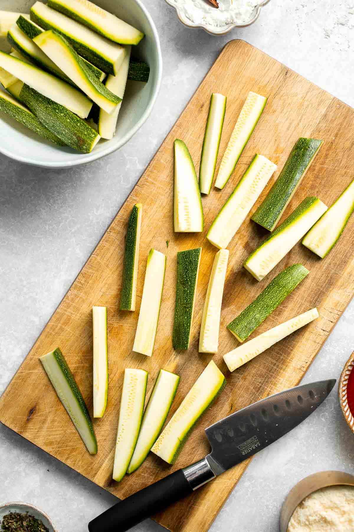 Baked Zucchini Fries are healthy, flavorful, and delicious. This summer vegetable is crispy on the outside while soft and creamy on the inside. | aheadofthyme.com